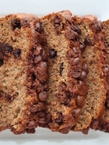 Slices of banana bread made with cake mix and bananas, showing the moist texture and chocolate chip pieces.