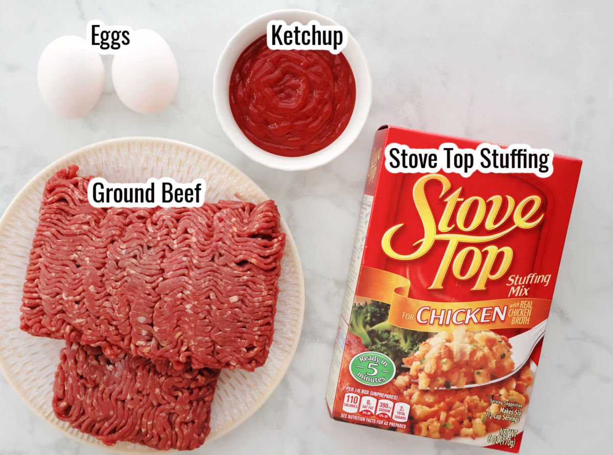 Overhead photo showing ground beef, eggs, ketchup, and a box of Stovetop stuffing on a white counter - labeled as ingredients for a 4 ingredient stuffing meatloaf