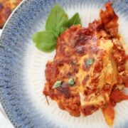 Close-up of cheesy baked pasta with sausage and mozzarella