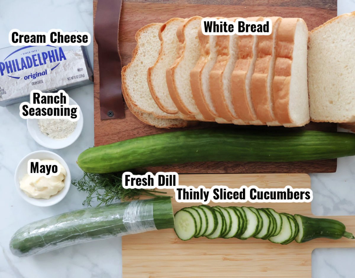 Ingredients laid out for cucumber ranch sandwiches: bread, cucumber, cream cheese, ranch seasoning