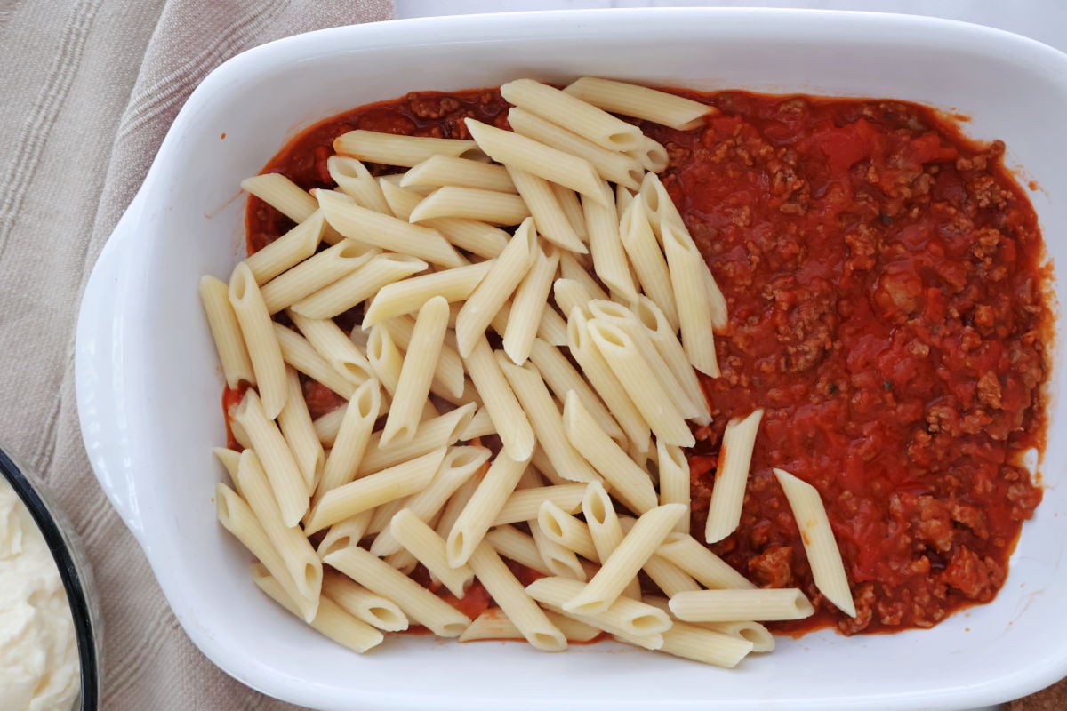 tomato and meat sauce as the base layer. Then rigatoni layered on top of the sauce.