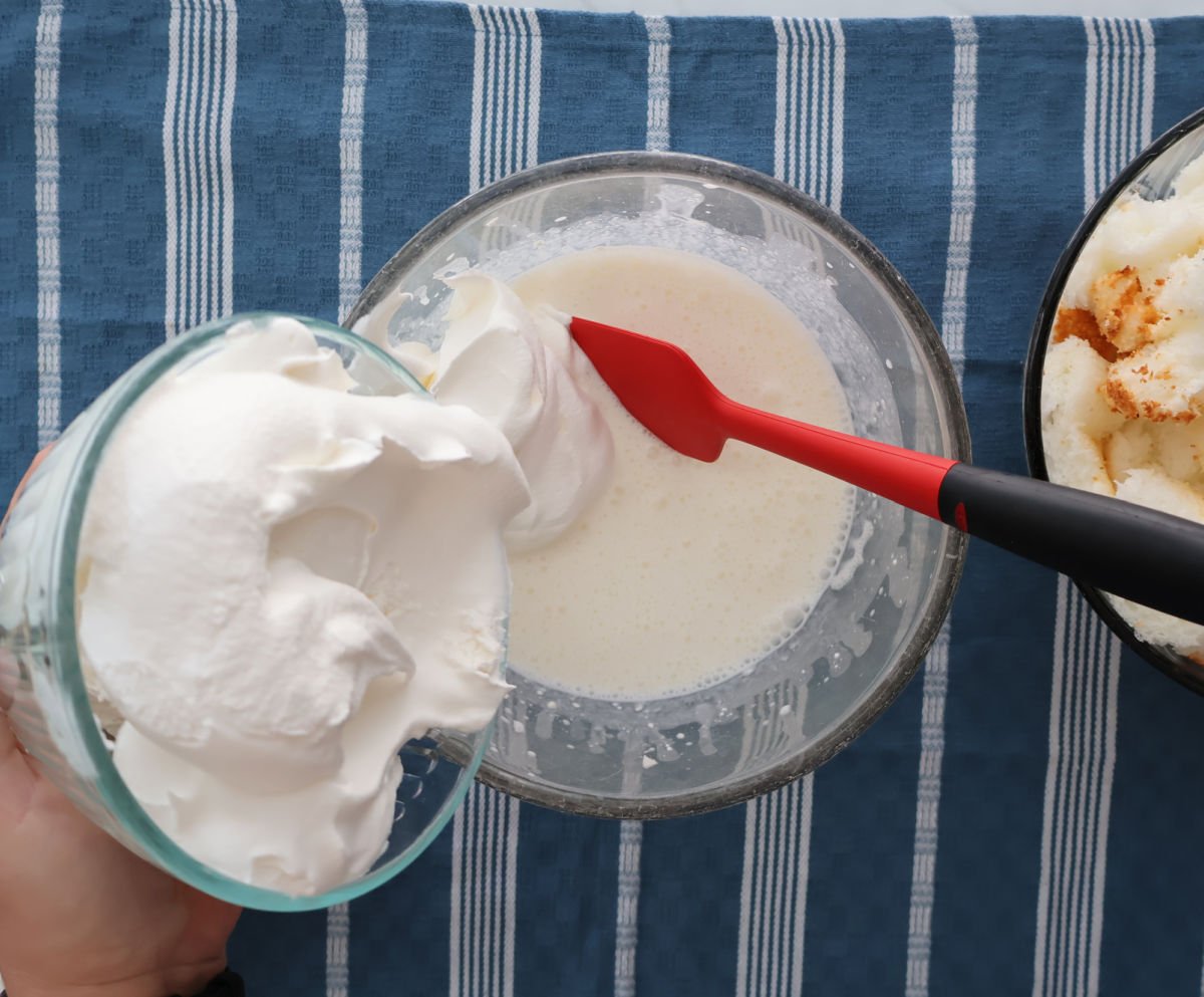 folding in whipped topping into cream cheese mixture.