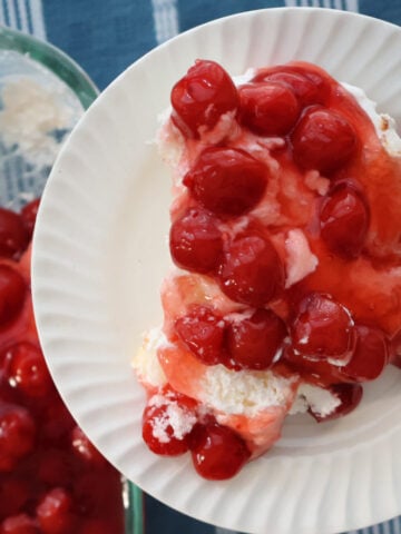 Cherries in the Snow with creamy layers and bright red cherry topping