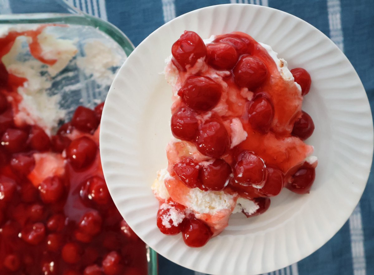 Cherries in the Snow with creamy layers and bright red cherry topping