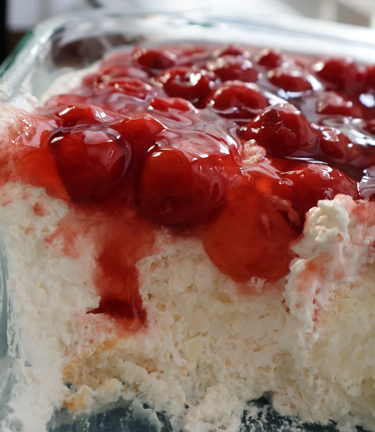 Cherries in the Snow with creamy layers and bright red cherry topping.