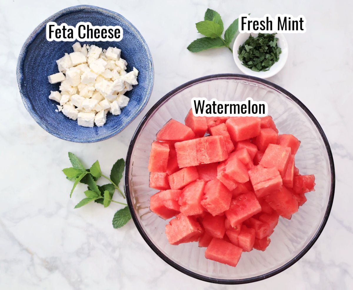 ingredients for watermelon feta salad including watermelon, feta cheese and fresh mint