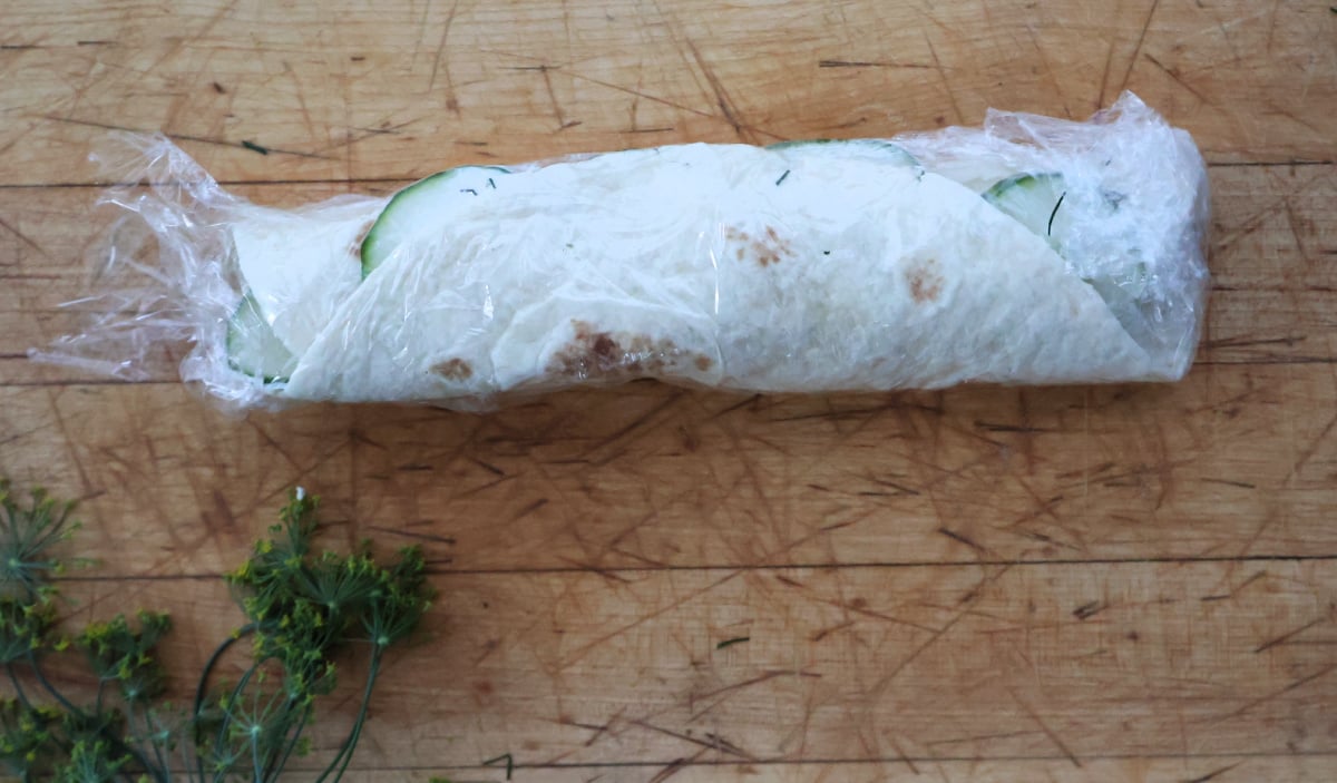 cucumber pinwheel rolled up to firm up the cream cheese and hold the pinwheels together.