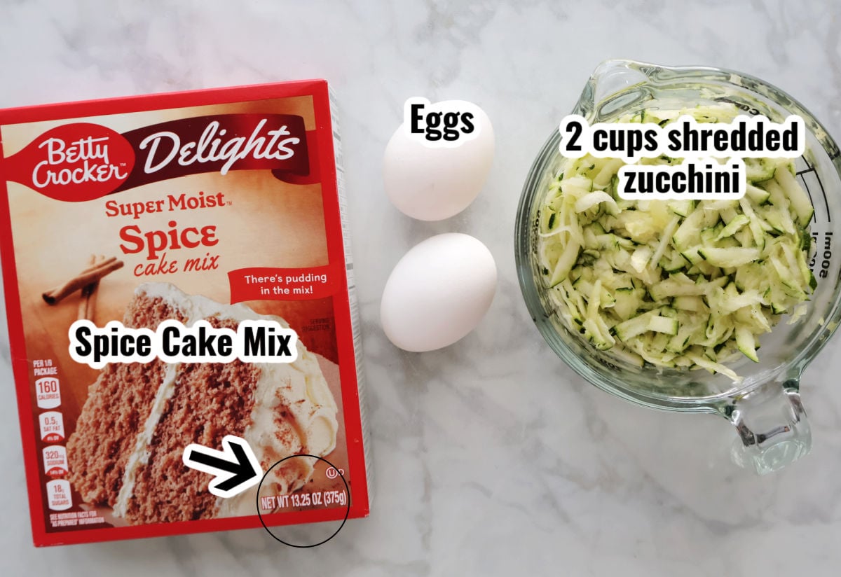 3 ingredients to make 3 ingredient zucchini cake. Includes spice cake, eggs and shredded zucchini.