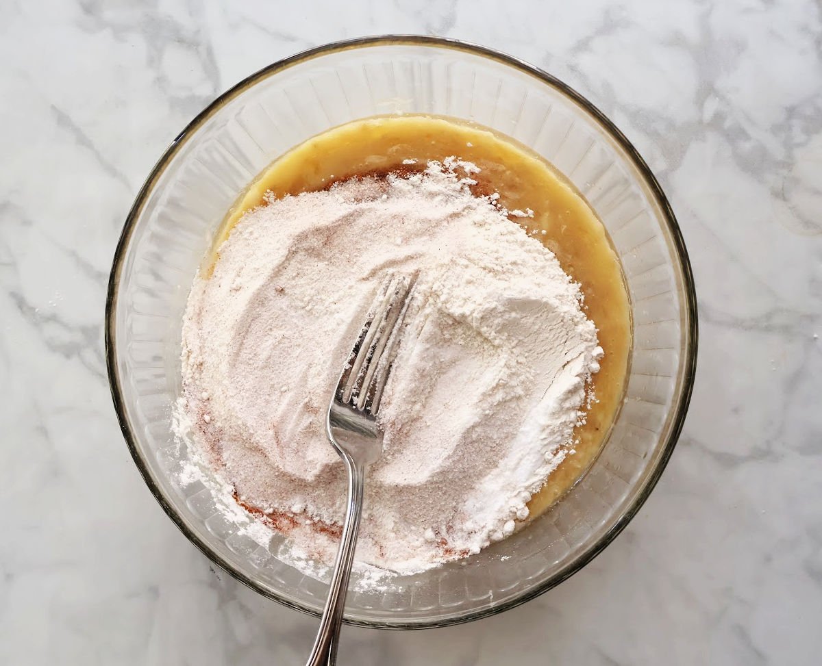 mixing dry ingredients on top of wet for banana batter.