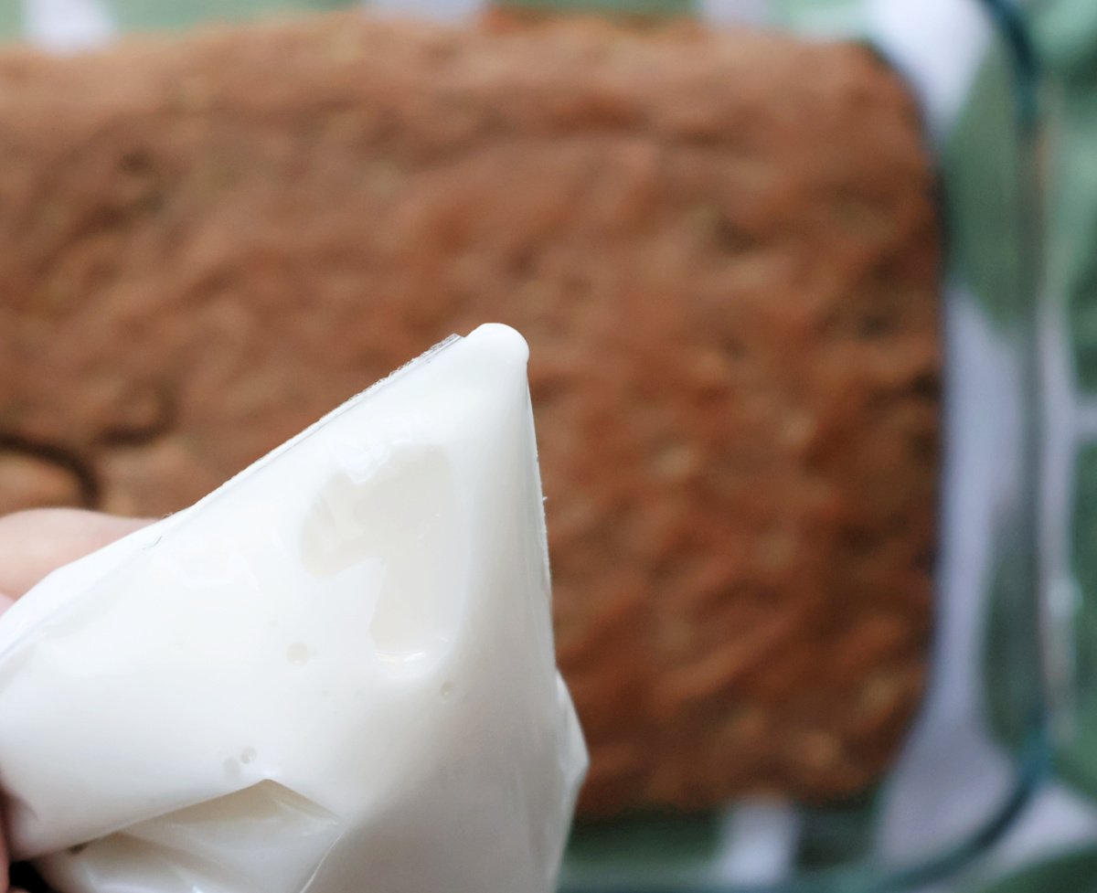 icing glaze made of powdered sugar and water. In a plastic bag with the corner cut off so it can be spread onto 3 ingredient zucchini cake.