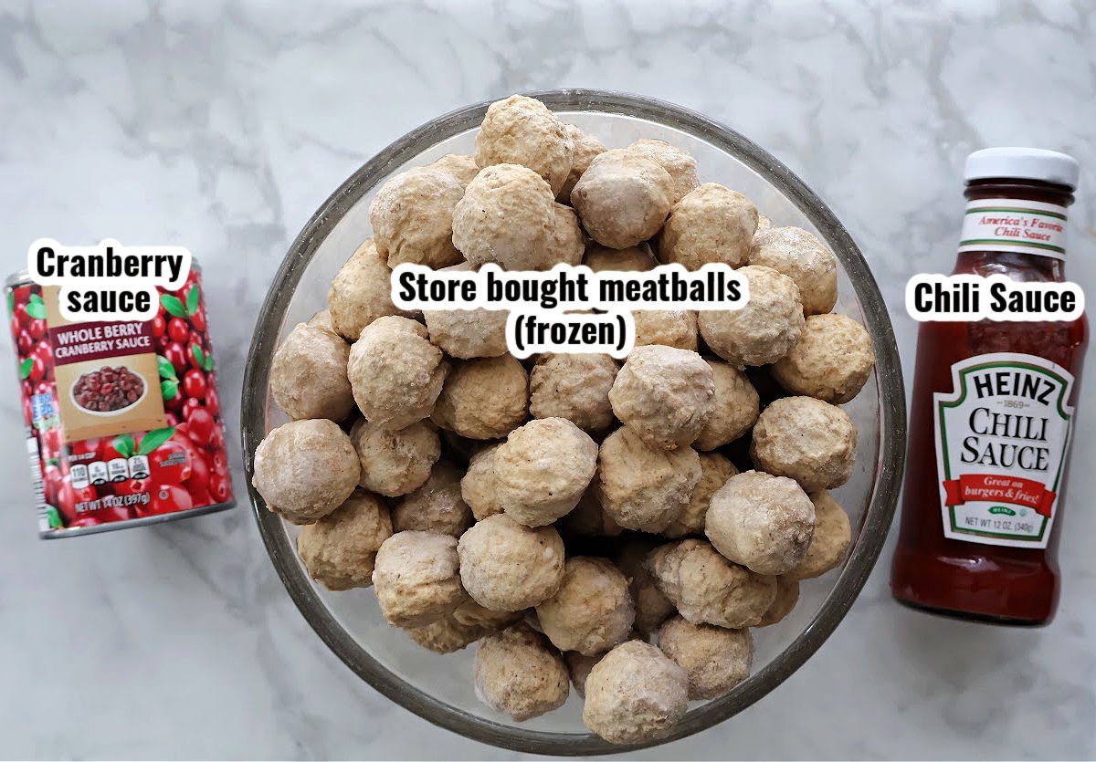 Frozen meatballs, canned cranberry sauce, and Heinz chili sauce laid out on a countertop