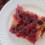 Cranberry orange upside down cake made with cake mix, topped with caramelized cranberries and orange zest.