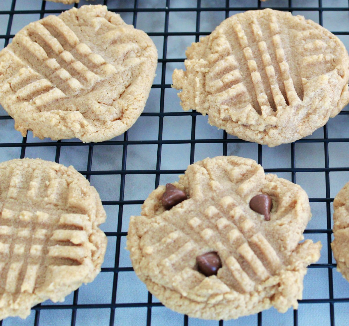 closeup of 3 ingredient peanut butter cookies on a cooling rack.