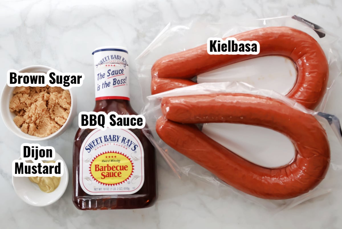 Ingredients for BBQ kielbasa including sliced kielbasa, BBQ sauce, and brown sugar.