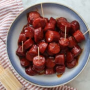 3 ingredient BBQ Kielbasa appetizer in a blue and white bowl.