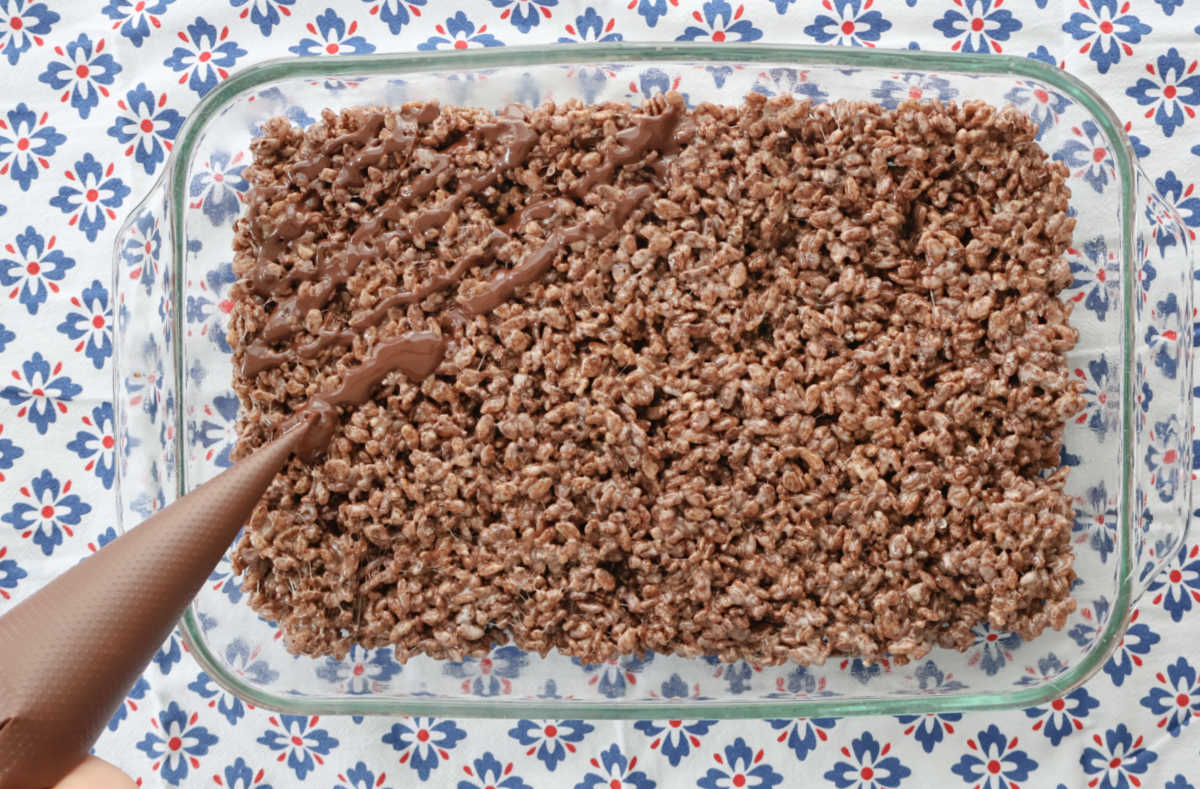 drizzle chocolate topping on chocolate rice krispies