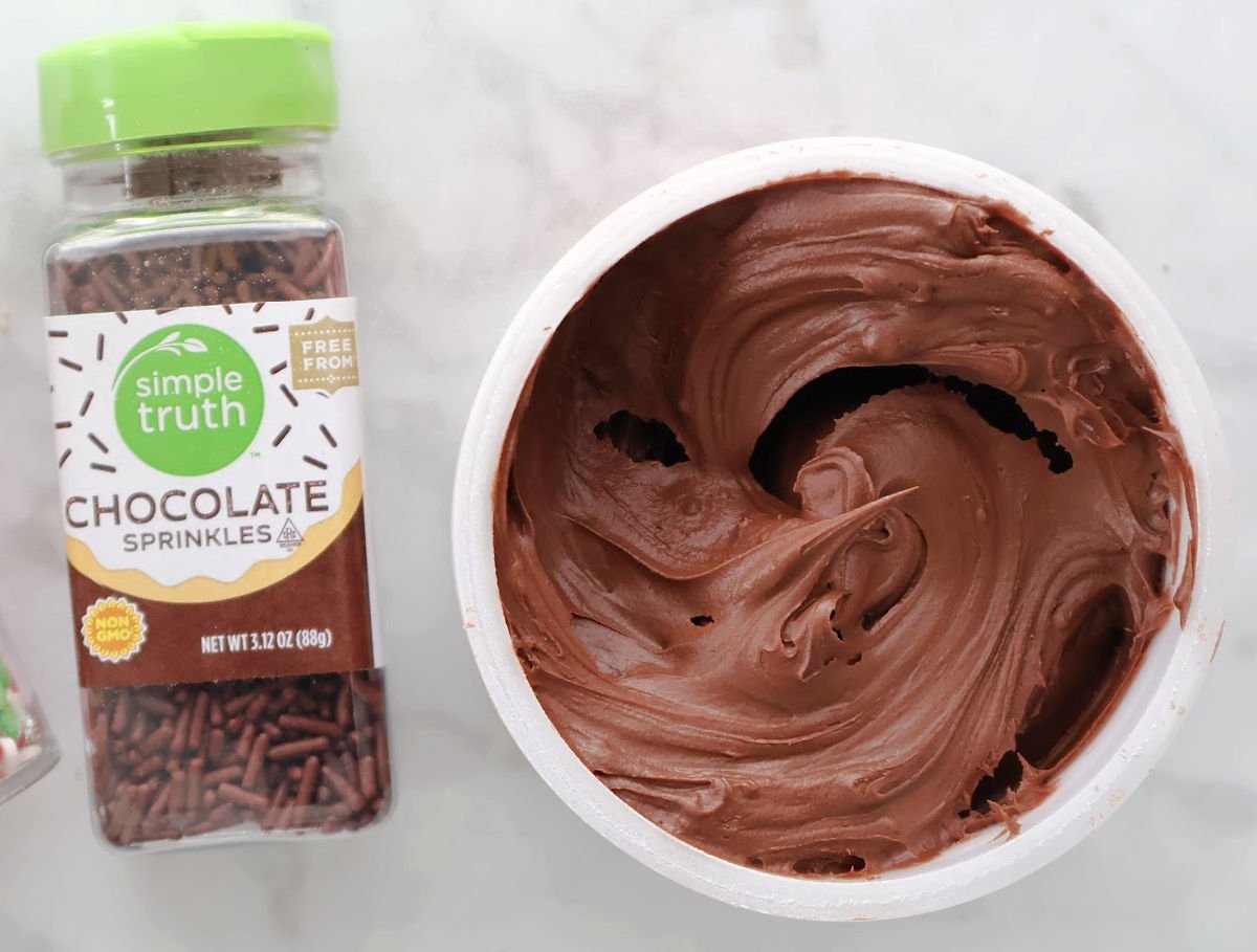 Chocolate sprinkles and chocolate frosting from the grocery store - for elevating the chocolate rice krispie  treats.