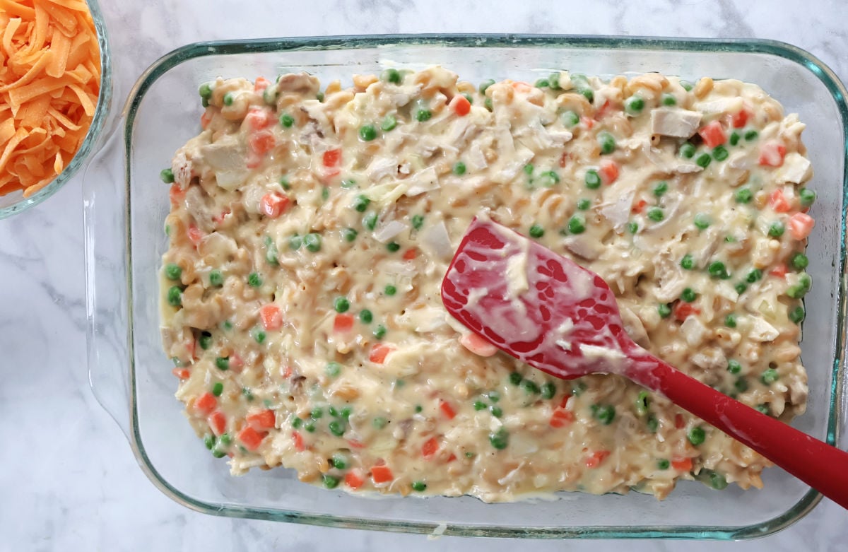 turkey casserole pouring into a baking dish