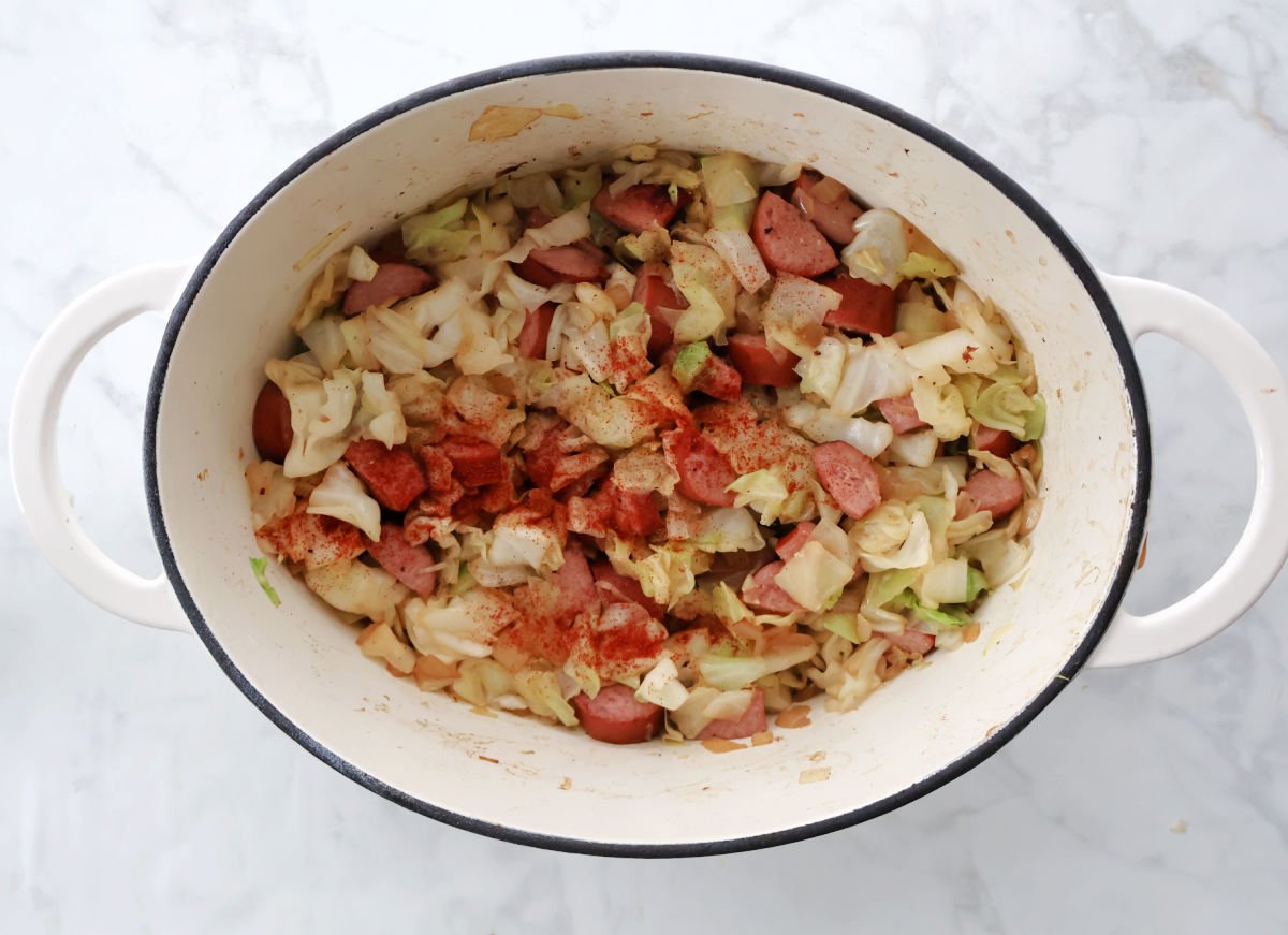 Smothered cabbage with kielbasa is a simple one-pot meal made in a Dutch oven with cabbage, sausage, onion, and basic seasonings. This easy comfort food recipe is filling, budget-friendly, and perfect for busy weeknights or cold-weather dinners.