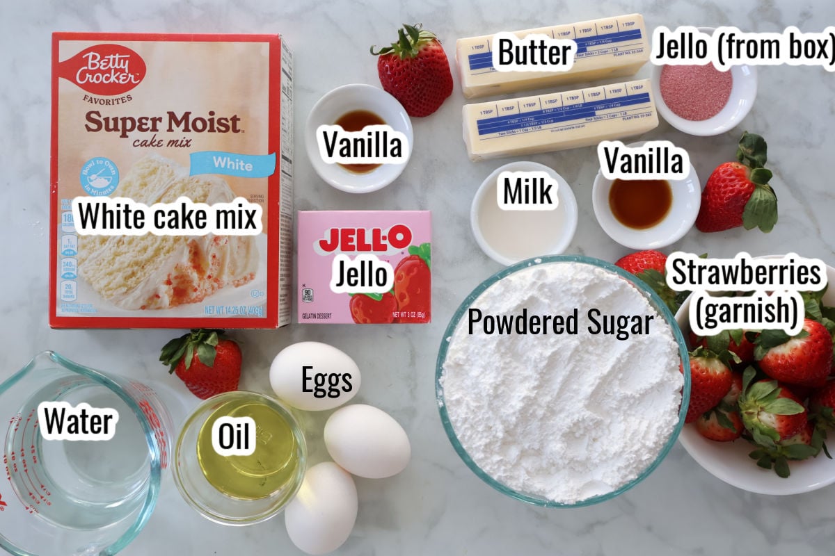 Ingredients for strawberry jello cake that includes white cake mix, jello for the cake.  The frosting includes powdered sugar, butter and jello for the color and flavor. 