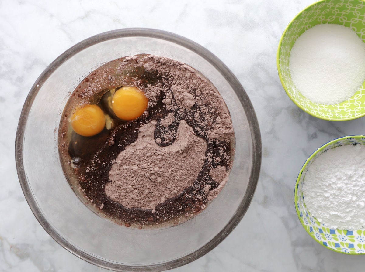 mixing chocolate crinkle cookie ingredients