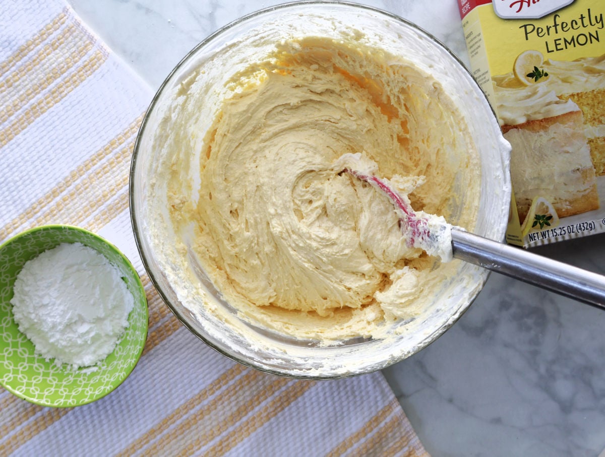 Lemon cake mix cookie dough made with Cool Whip and egg in a mixing bowl.
