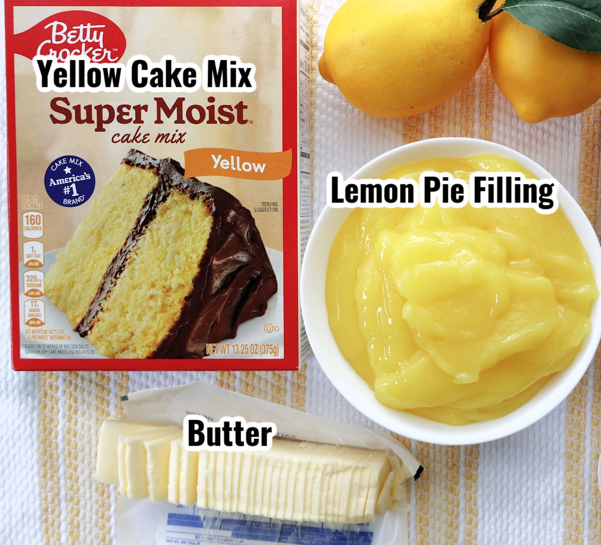 Ingredients for lemon dump cake including cake mix, lemon curd, and butter