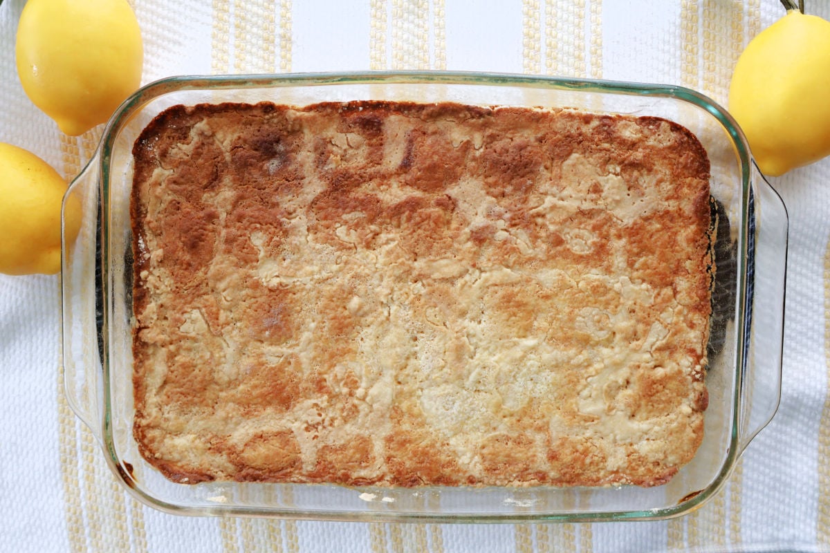 Close-up of lemon dump cake showing soft cake topping and lemon layer underneath