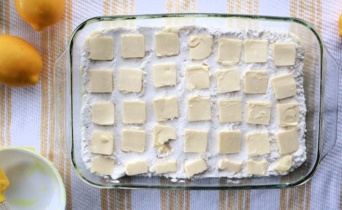 Dry cake mix layered over lemon curd in baking dish