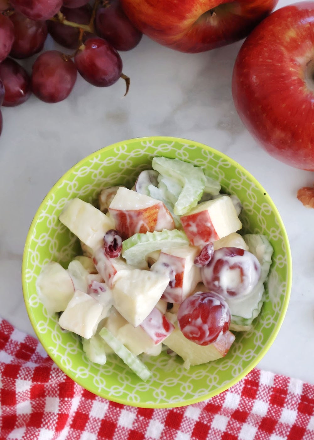 Apple salad with walnuts and grapes